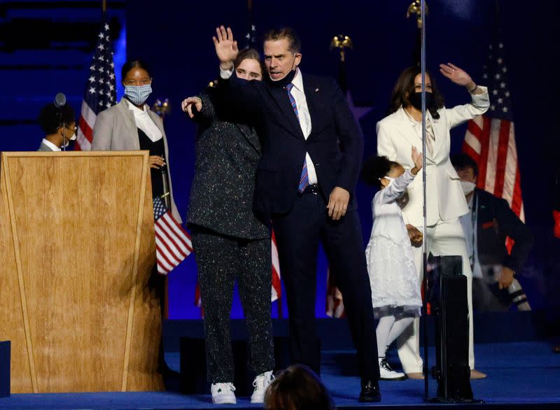 Hunter Biden celebrates onstage at the election rally in Wilmington