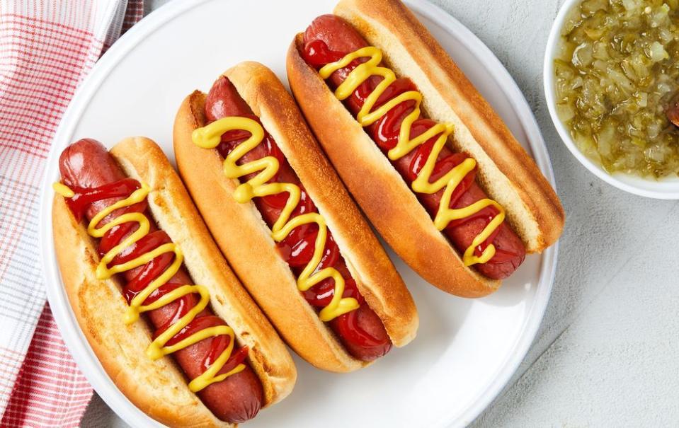 <p>Using your air fryer for hot dogs gives you grill quality without the hassle of cleaning the grates and waiting for the grill to preheat. </p><p>Get the <a href="https://www.delish.com/uk/cooking/recipes/a38410117/air-fryer-hot-dogs-recipe/" rel="nofollow noopener" target="_blank" data-ylk="slk:Air Fryer Hot Dogs;elm:context_link;itc:0;sec:content-canvas" class="link ">Air Fryer Hot Dogs</a> recipe.</p>