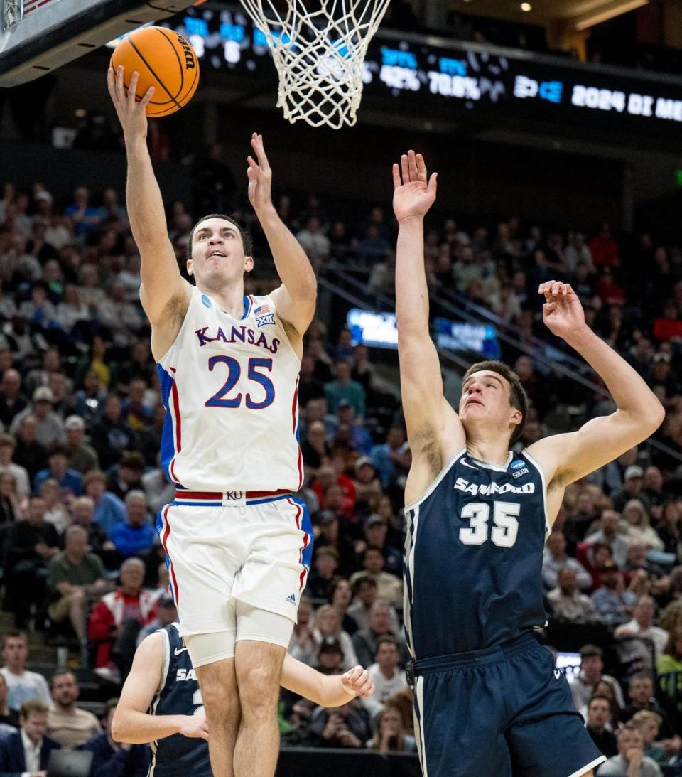 Kansas Jayhawks guard Nicolas Timberlake (25) shoots a layup as Samford Bulldogs center Riley Allenspach (35) contests the shot during a men’s college basketball game in the first round of the NCAA Tournament on Thursday, March 21, 2024, in Salt Lake City, Utah. Nick Wagner/nwagner@kcstar.com