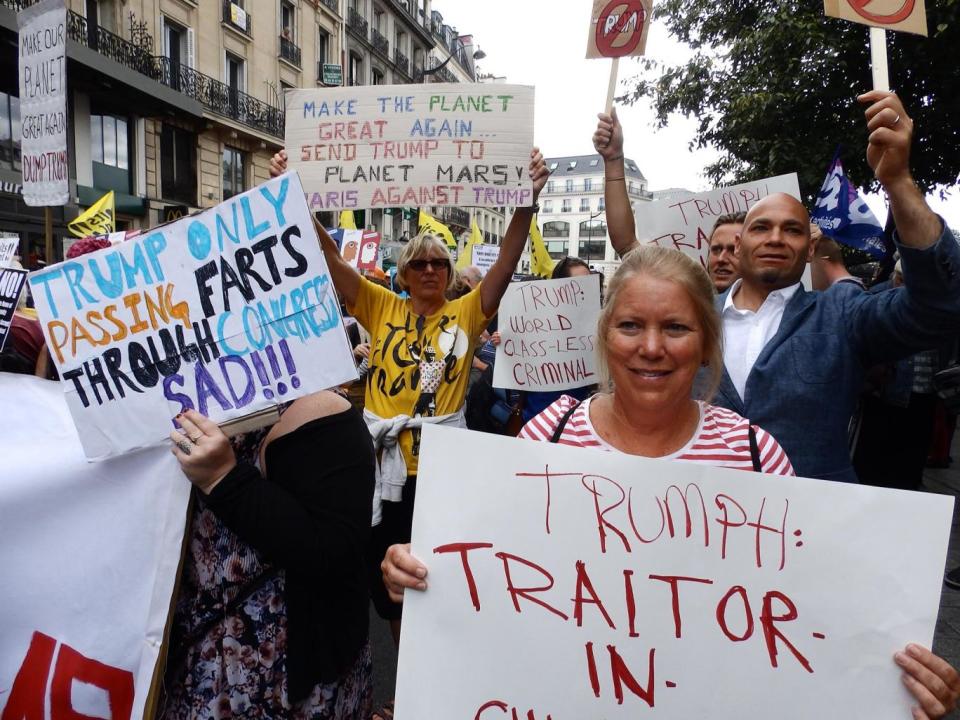 Protesters from the Droits Devant migrants' rights group at a Bastille Day march in Paris on 14 July 2017 (Lizzie Dearden)