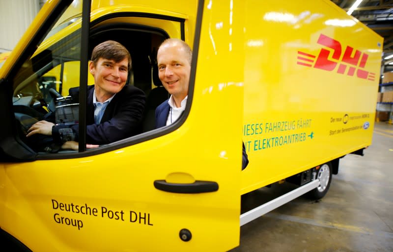 FILE PHOTO: SreetScooter CEO Kampker and Ford Europe's engineering director Beyer look through the window of a StreetScooter WORK XL electric van in Cologne