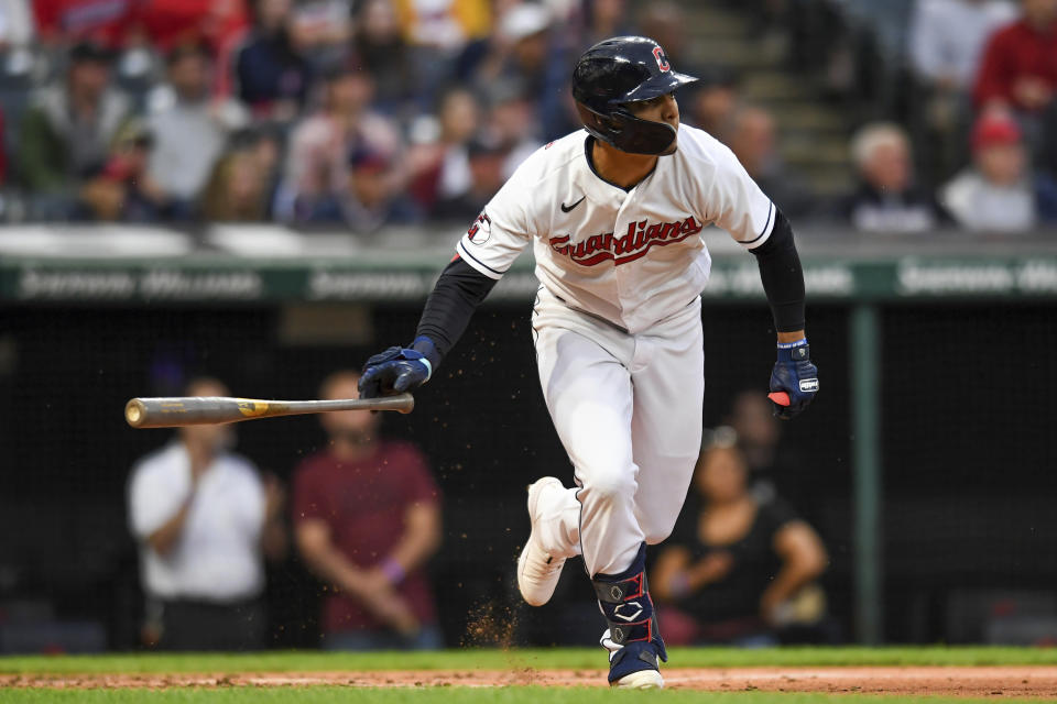 Cleveland Guardians' Andrés Giménez runs leaves the batter's box after hitting an RBI double against the Texas Rangers during the second inning of a baseball game Wednesday, June 8, 2022, in Cleveland. (AP Photo/Nick Cammett)