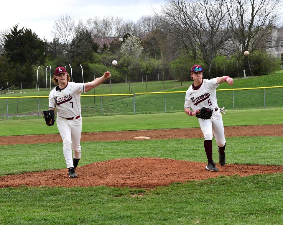 Lebanon pitchers Parker Dillhoff (7) and Colton Hartman (5) bring a dual threat to the mound for the Warriors, April 12, 2022.