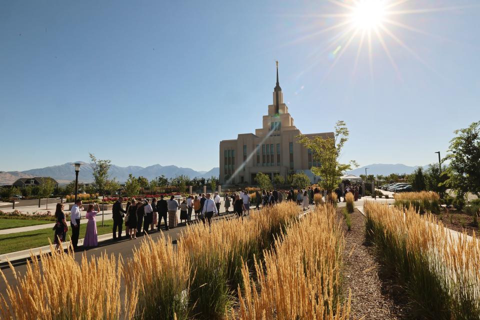 People stand in line as they wait for the first of two sessions for the dedication of the Saratoga Springs Utah Temple in Saratoga Springs, Utah, on Sunday, Aug. 13, 2023. | Scott G Winterton, Deseret News