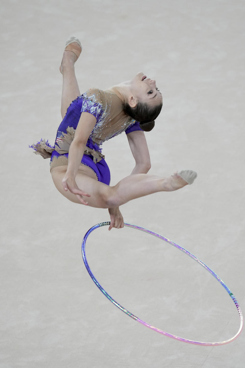 FILE - Evita Griskenas of the United States competes in the gymnastics rhythmic individual hoop final at the Pan American Games in Santiago, Chile, Friday, Nov. 3, 2023. Rhythmic gymnast Evita Griskenas' core memories of the Olympics have to do with ... herself. Evita drew pictures of Evita on a medal stand and envisioned herself winning one of those medals someday. (AP Photo/Esteban Felix, File)