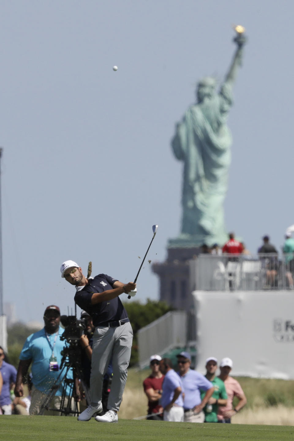 Abraham Ancer, of Mexico, hits from the third fairway in the final round in the Northern Trust golf tournament at Liberty National Golf Course, Sunday, Aug. 11, 2019, in Jersey City, N.J. (AP Photo/Mark Lennihan)