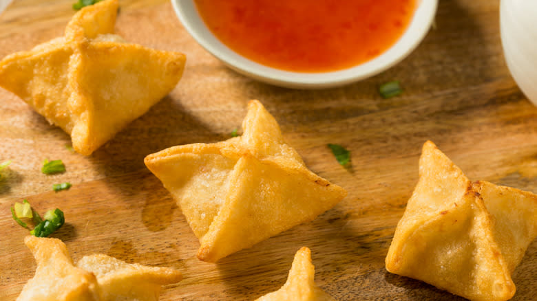 Crab rangoons with red sauce