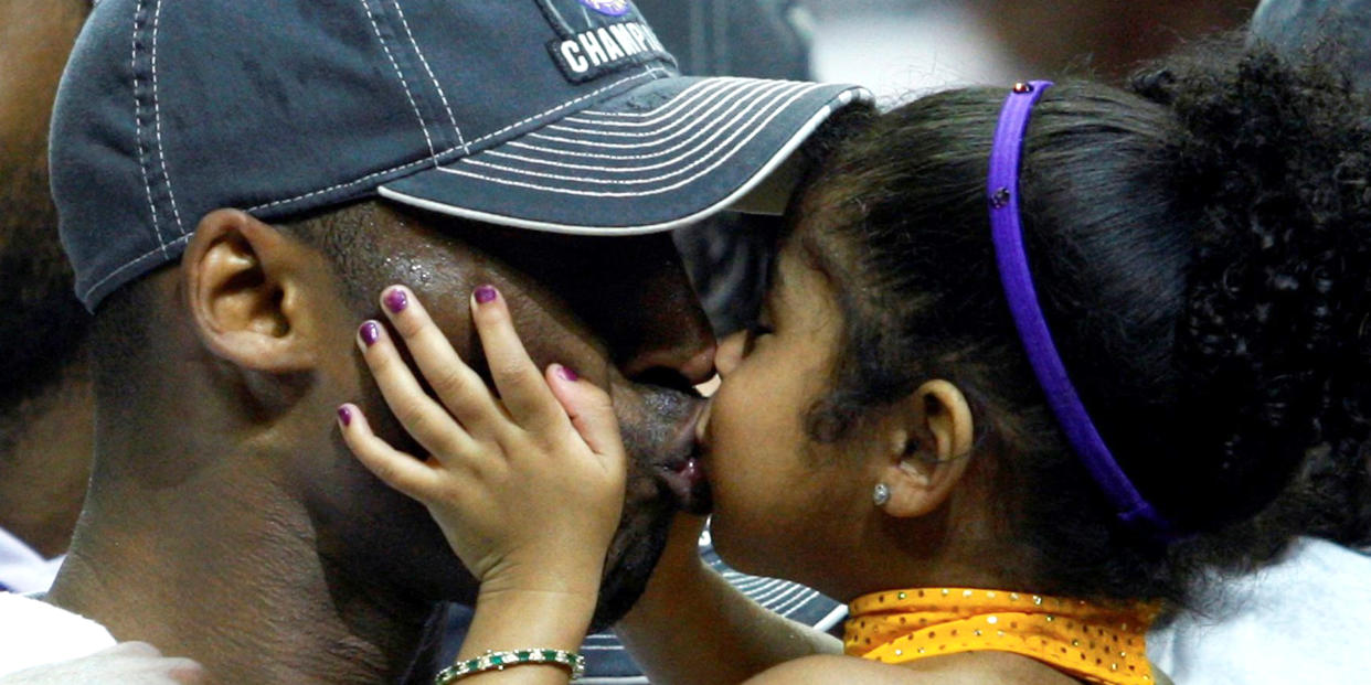 Image: FILE PHOTO: Los Angeles Lakers Kobe Bryant kisses his daughter Gianna after they defeated the Orlando Magic to win the NBA basketball championship in Orlando (Hans Deryk / Reuters)