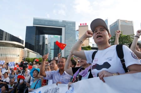 Supporters attend a rally to show their support for the police amid criticisms for its alleged mishandling of an anti-extradition protest, in Hong Kong