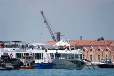 A boat is seen after a crash with MSC Opera at San Basilio dock in Venice