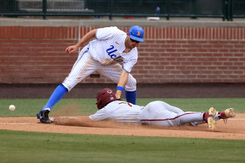 UCLA third baseman Kyle Karros can't handle the ball as Florida State's Jaime Ferrer (7) slides in safely June 3, 2022.