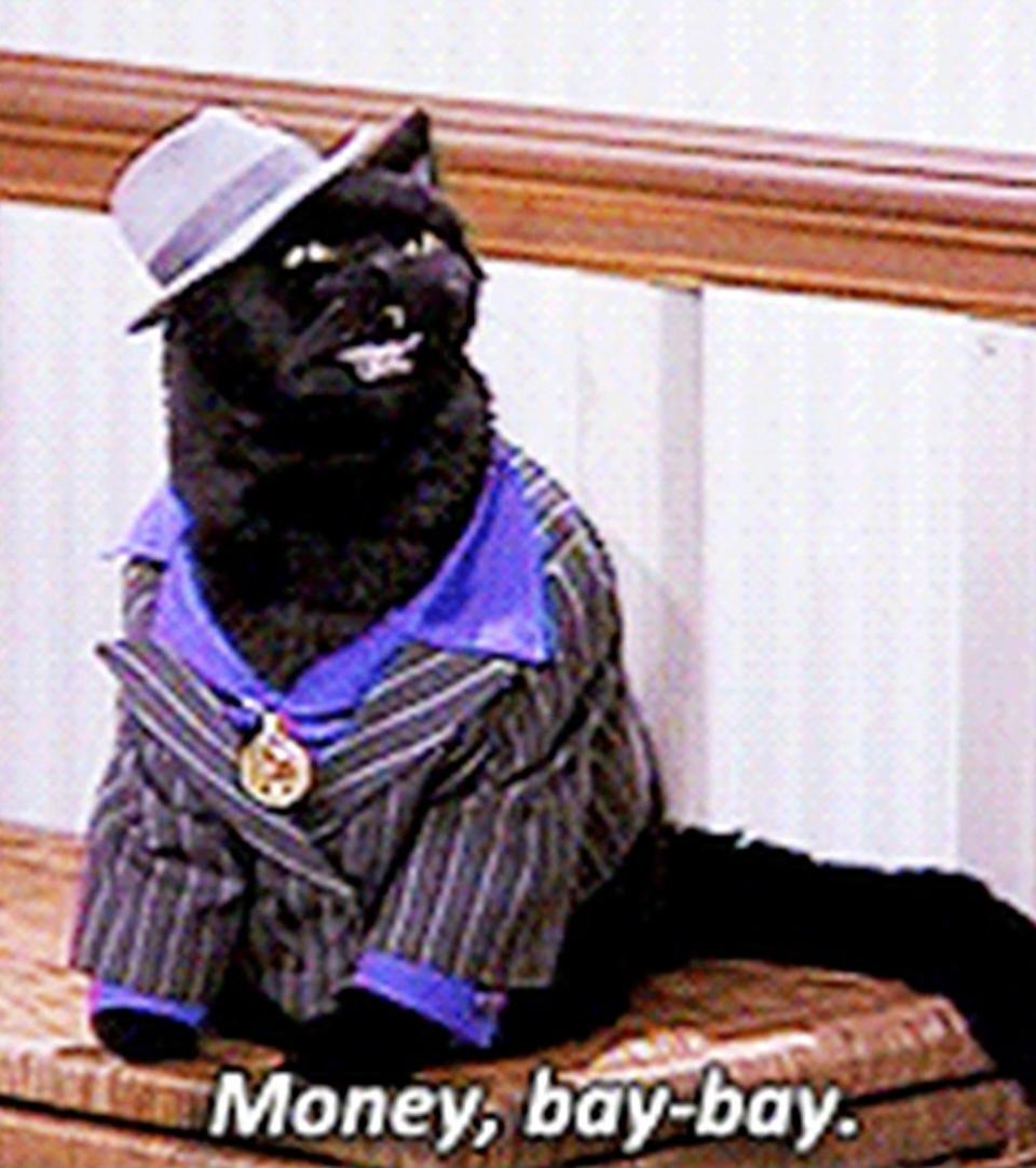 Salem wears a gangster outfit and says, "Money, baby"