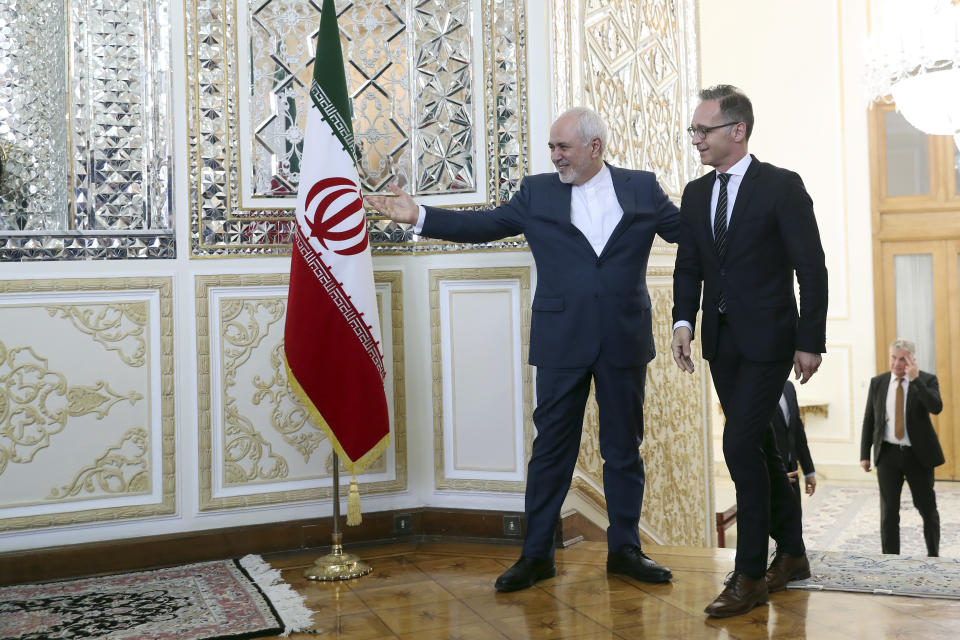 Iranian Foreign Minister Mohammad Javad Zarif, left, welcomes his German counterpart Heiko Maas for their meeting, in Tehran, Iran, Monday, June 10, 2019. (AP Photo/Ebrahim Noroozi)
