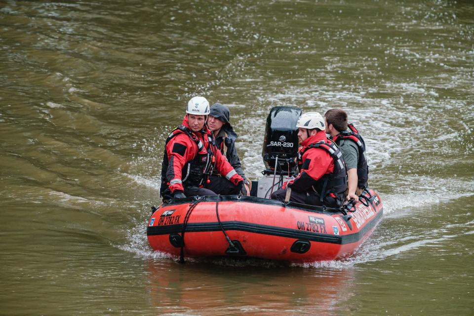 Rescue personnel search the Tuscarawas River on June 6 for a 25-year-old Baltic man who went missing in the water June 4. He was found dead near Port Washington.