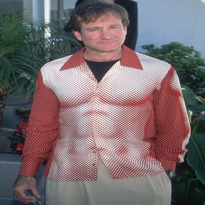 Robin Williams wearing a shirt that depicts a man's torso