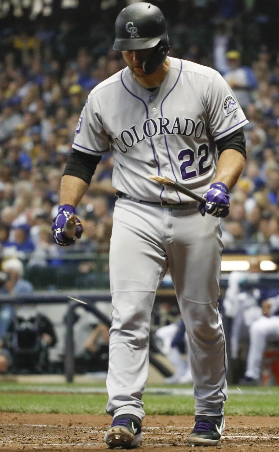 Colorado Rockies' Chris Iannetta (22) breaks his bat after striking out during the seventh inning of Game 2 of the National League Divisional Series baseball game against the Milwaukee Brewers Friday, Oct. 5, 2018, in Milwaukee. (AP Photo/Jeff Roberson)