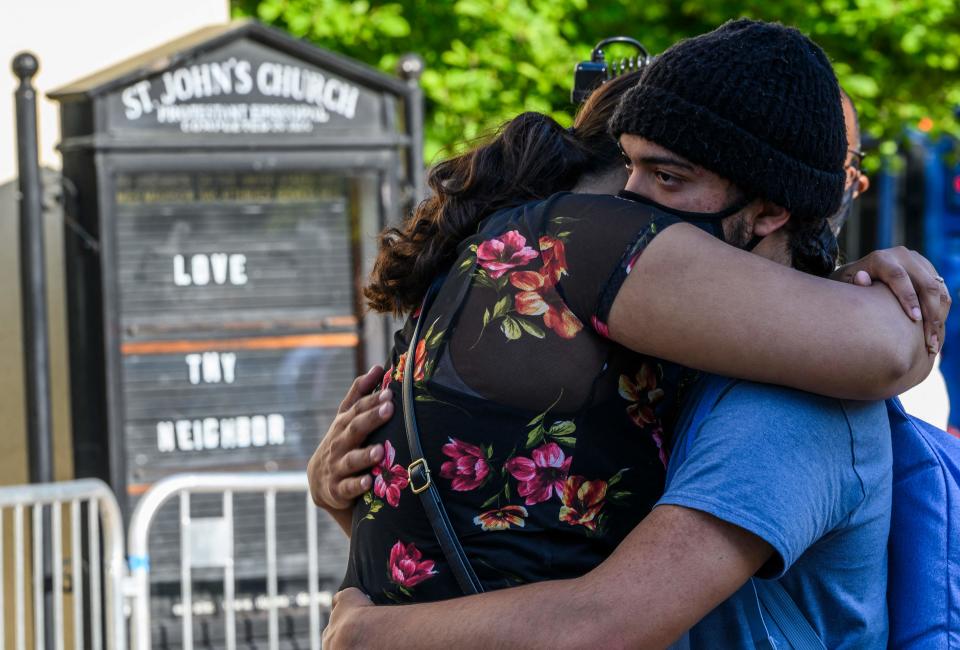 People react to the verdict in Derek Chauvin's trial in Washington, DC on April 20, 2021.