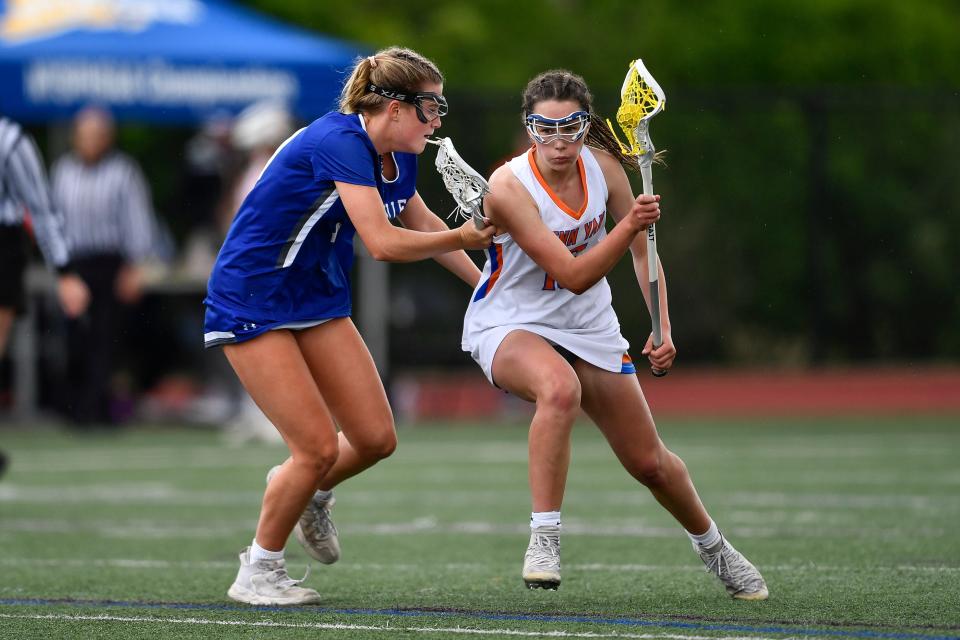 Penn Yan's Bailey Cooper, right, is defended by Bronxville's Rose Woolery during a NYSPHSAA Girls Lacrosse  Championships Class D semifinal in Cortland, N.Y., Friday, June 9, 2023. Bronxville advanced to the Class D final after an 18-8 win over Penn Yan.