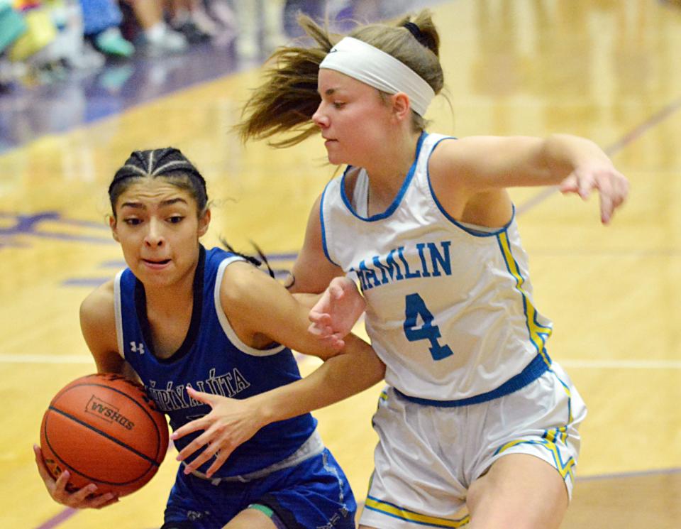 Red Cloud's Lolo Carlow drives to the basket against Hamlin's Brooklyn Brandriet during their semifinal game in the state Class A high school girls basketball tournament on Friday, March 10, 2023 in the Watertown Civic Arena.