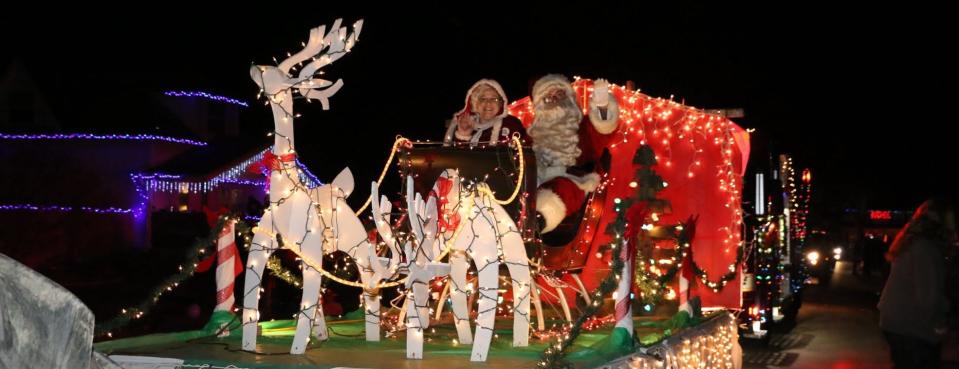Santa and Mrs. Claus ride in a previous Christmas in Ida Parade of Lights. This year's parade is Saturday.