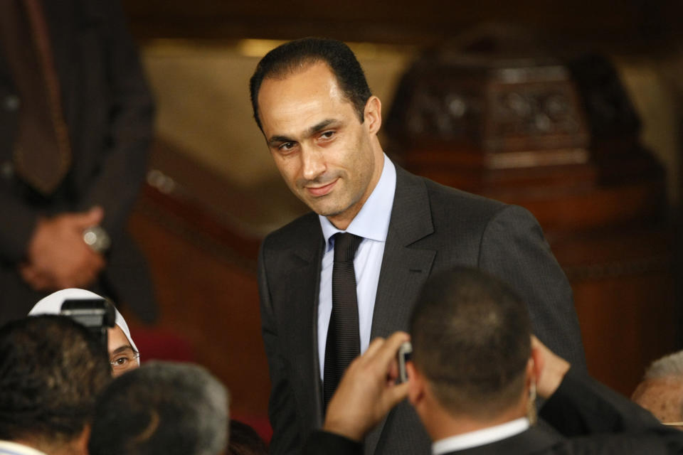 FILE - Gamal Mubarak, center, son of Egyptian President Hosni Mubarak, talks to guests prior to the speech of U.S. President Barack Obama at Cairo University in Cairo, Egypt, Thursday, June 4, 2009. Swiss prosecutors are concluding without any charges a decade-long investigation into alleged money laundering and organized crime linked to late former President Hosni Mubarak’s circles in Egypt, and will release some 400 million Swiss francs ($430 million) frozen in Swiss banks. The office of the Swiss attorney general said Wednesday, April 13, 2022, that information received as part of cooperation with Egyptian authorities wasn’t sufficient to back up the claims that emerged in the wake of Arab Spring uprisings in 2011 that felled Mubarak’s three-decade rule. Mubarak's sons, Alaa and Gamal, hailed the decision as a full exoneration. (AP Photo/Ben Curtis, File)