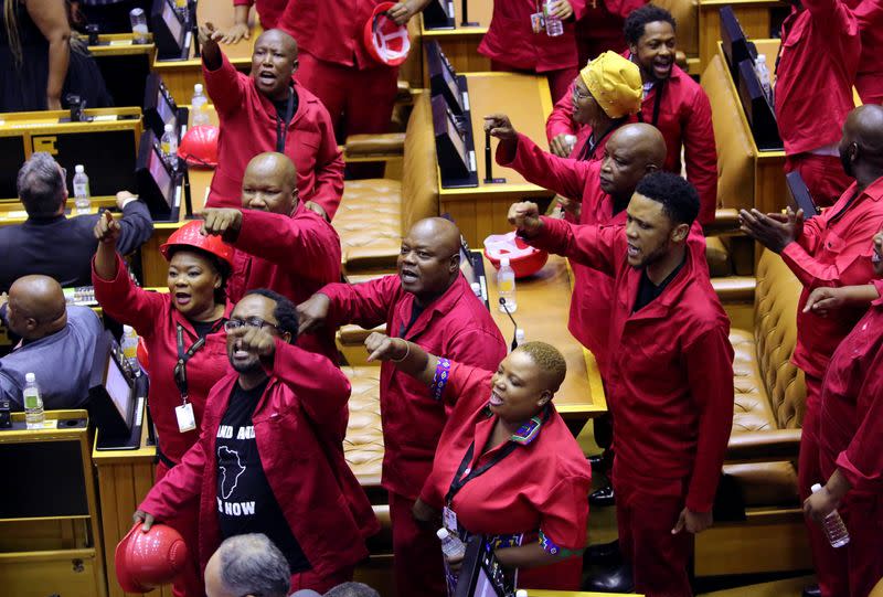 Members of the opposition Economic Freedom Fighters (EFF) party object as South African President Cyril Ramaphosa attempts to deliver his State of the Nation address at parliament in Cape Town