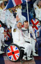 LONDON, ENGLAND - AUGUST 29: Wheelchair tennis player Peter Norfolk of Great Britain carries the flag during the Opening Ceremony of the London 2012 Paralympics at the Olympic Stadium on August 29, 2012 in London, England. (Photo by Gareth Copley/Getty Images)