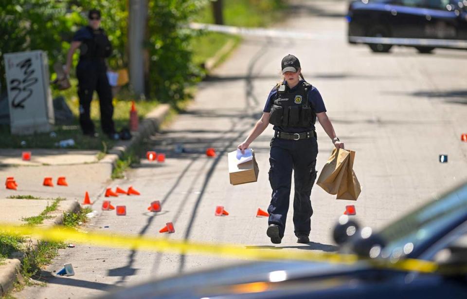 Police and crime scene investigators were on the scene collecting evidence where three people died and five were injured following a shooting early Sunday, June 25, 2023, near 57th Street and Prospect Avenue in Kansas City. Super Bowl KC Star