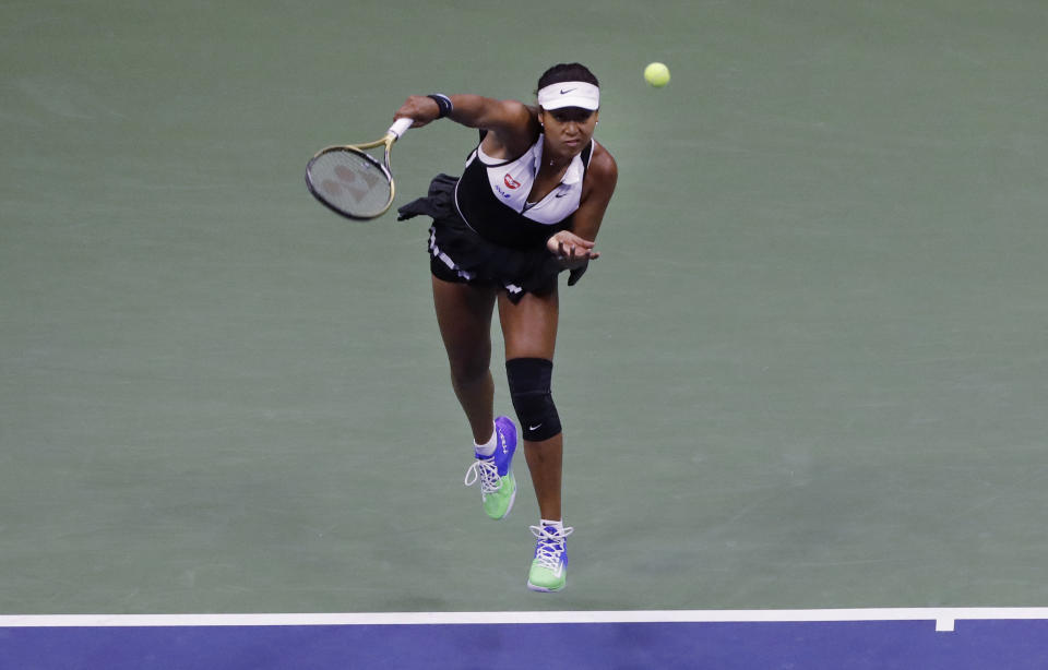 Naomi Osaka, of Japan, serves against Belinda Bencic, of Switzerland, during the fourth round of the US Open tennis championships Monday, Sept. 2, 2019, in New York. (AP Photo/Frank Franklin II)