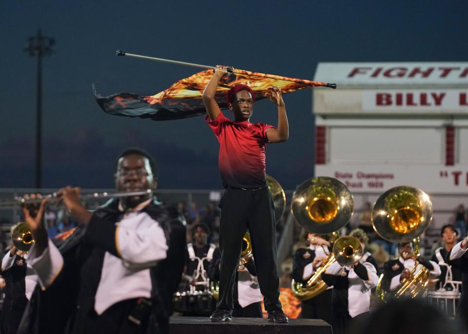 Treasure Coast High School marching band and color guard perform during the 41st annual Crown Jewel Marching Band Festival on Saturday, Oct. 8, 2022, at Vero Beach High School. The Crown Jewel is one of the oldest continuous marching festivals in Florida.