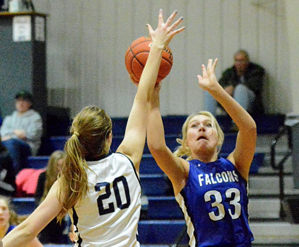 Florence-Henry's Caylin Kelly shoots against Great Plains Lutheran's Olivia Holmen during a high school basketball doubleheader on Thursday, Jan. 26, 2023 in Watertown.