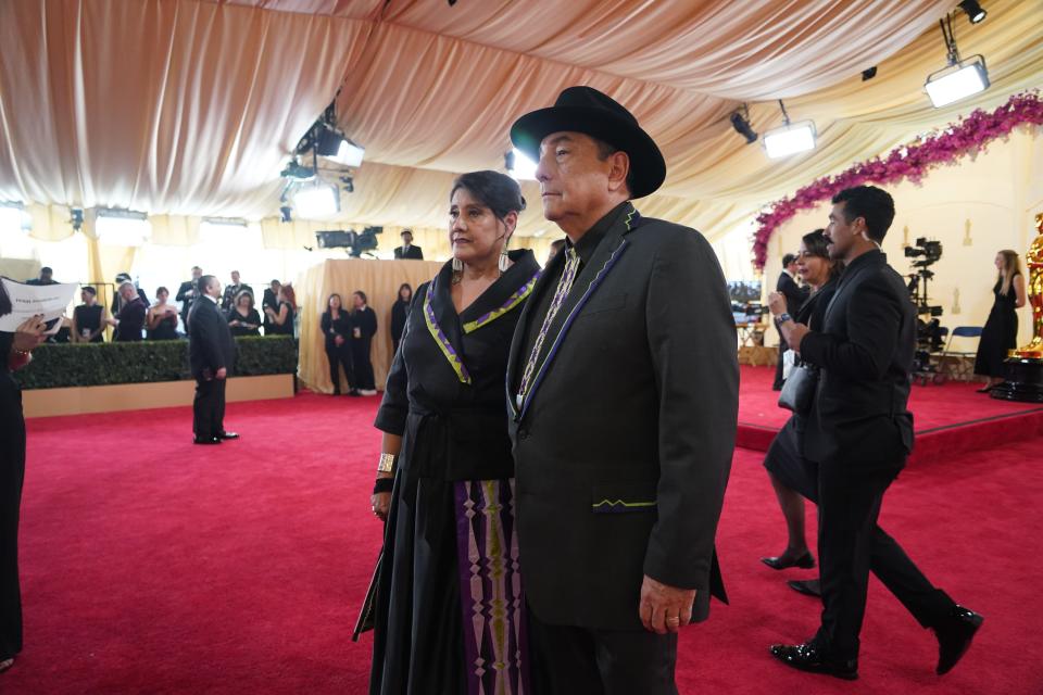 Osage singer Scott George poses on the Oscars red carpet with his wife Taveah George. Scott George was there to perform “Wahzhazhe (A Song for My People)” from Martin Scorsese’s Killers of the Flower Moon with Osage Singers at the 2024 Oscars.