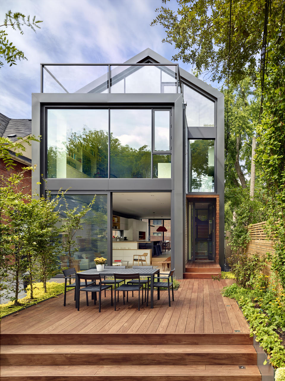 An outdoor deck with tropical trees