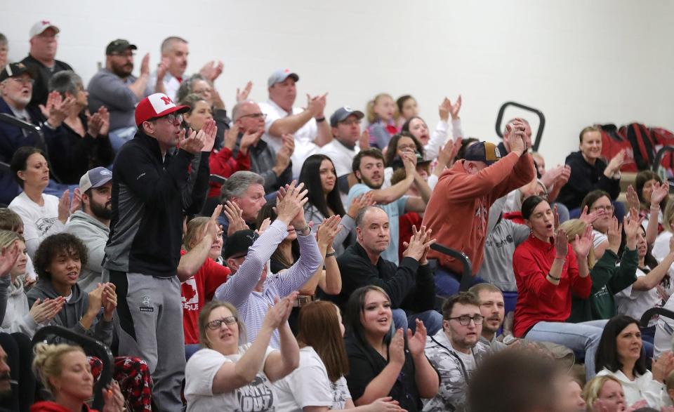 Minerva fans cheer on the boys basketball team during a district semifinal against Maysville, Wednesday, March 6, 2024, at Claymont High School.