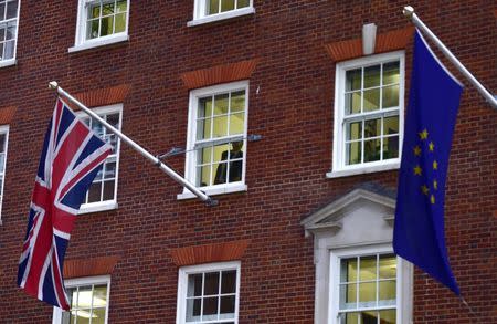 European Union and the British Union flags are seen flying outside of Europe House in London, November 10, 2015. REUTERS/Toby Melville