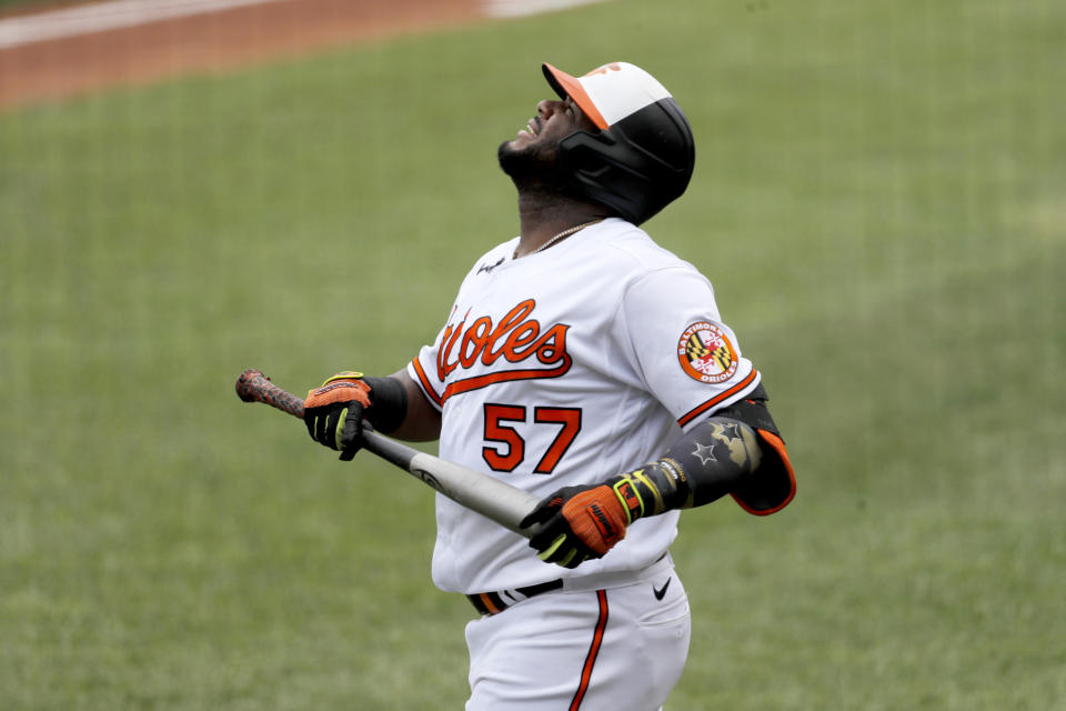 Baltimore Orioles' Hanser Alberto reacts while stepping up to the plate against the Tampa Bay Rays during the first inning of a baseball game, Sun, Aug. 2, 2020, in Baltimore. (AP Photo/Julio Cortez)