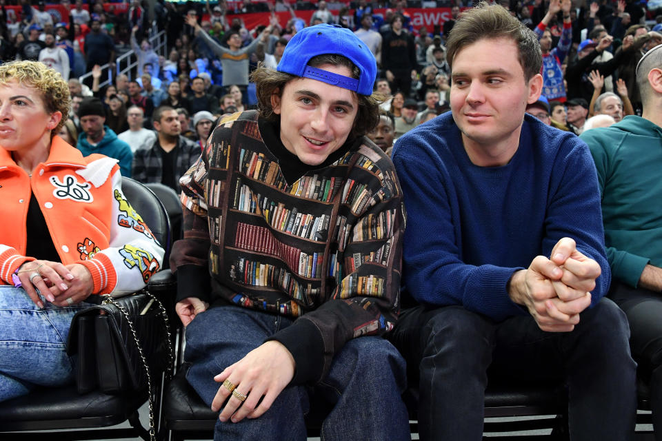 timmy sitting courtside at a sports event