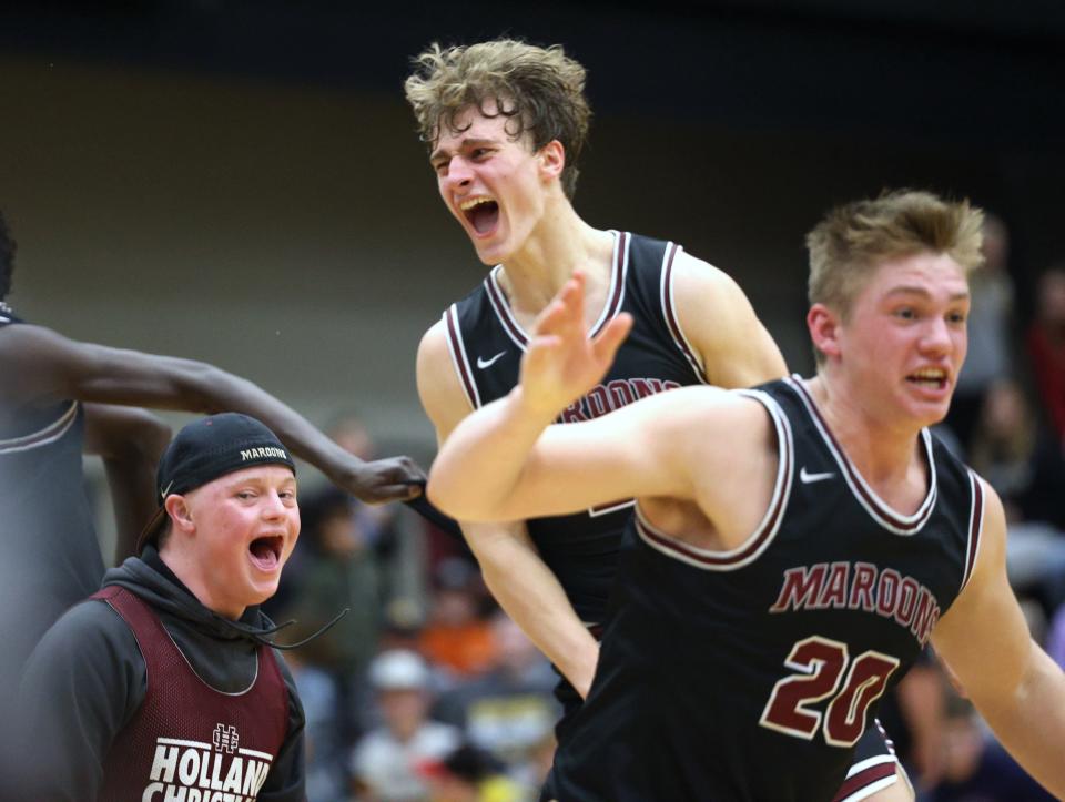 Holland Christian's Luke Michmerhuizen celebrated with teammates after beating Hamilton on Friday, Feb. 16, 2024, at Hamilton.