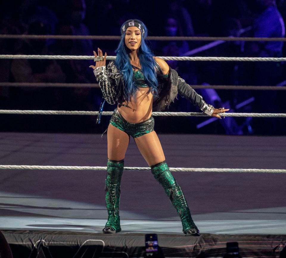 WWE diva Sasha Bank gets introduced before her match on Saturday, Dec. 18, 2021, at the BMO Harris Bank Center in Rockford.