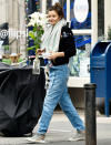 <p>Helena Christensen carries fresh-cut flowers on Thursday while out in N.Y.C.</p>