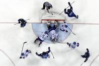 Ice Hockey - Pyeongchang 2018 Winter Olympics - Men’s Playoff Match - Finland v South Korea - Gangneung Hockey Centre, Gangneung, South Korea - February 20, 2018. Juuso Hietanen of Finland scores his team's fourth goal. REUTERS/Grigory Dukor