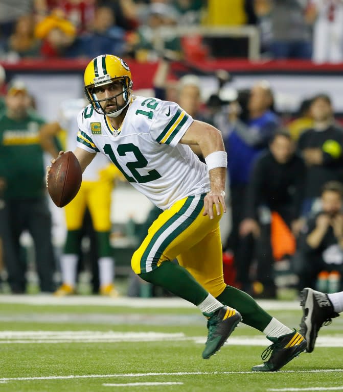 Aaron Rodgers of the Green Bay Packers scrambles against the Atlanta Falcons during the fourth quarter in the NFC Championship Game at the Georgia Dome on January 22, 2017 in Atlanta, Georgia