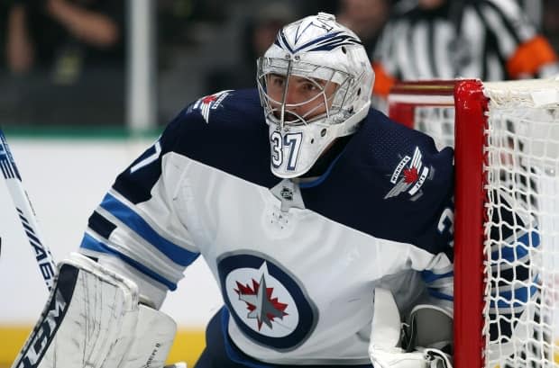 Jets goaltender Connor Hellebuyck says he's ready for the 2021-22 season after recovering from a COVID-19 infection he got in August while unvaccinated. (Ronald Martinez/Getty Images - image credit)