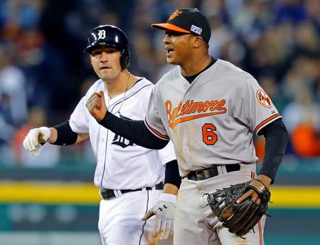 Oct 5, 2014; Detroit, MI, USA; Baltimore Orioles second baseman Jonathan Schoop (6) celebrates in front of Detroit Tigers third baseman Nick Castellanos (9) after defeating the Tigers in game three of the 2014 ALDS baseball playoff game at Comerica Park. The Orioles move on to the ALCS with 2-1 win over the Tigers. Mandatory Credit: Rick Osentoski-USA TODAY Sports