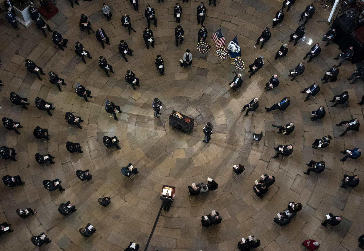 Senate Majority Leader Chuck Schumer of N.Y., speaks during a ceremony memorializing U.S. Capitol Police officer Brian Sicknick, as an urn with his cremated remains lies in honor on a black-draped table at the center of the Capitol Rotunda, Wednesday, Feb. 3, 2021, in Washington. (Kevin Dietsch/Pool via AP)