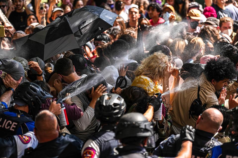 Police used pepper spray against protesters who were blocking police vehicles from leaving the University of Texas campus Monday. Police arrested 79 demonstrators Monday at UT. Reactions to the UT protests have largely split along party lines.