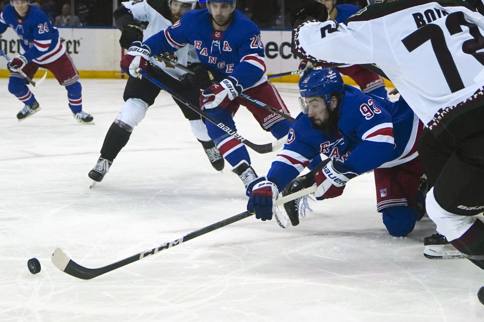 New York Rangers' Mika Zibanejad (93) dives for the puck during an NHL hockey game against the Arizona Coyotes, Monday, Oct. 16, 2023, in New York. (AP Photo/Bebeto Matthews)