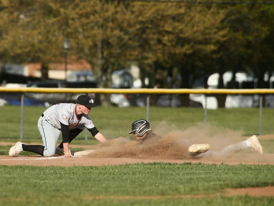 Liberty Christian's Dawson Kamppi gets Granville Christian's Bentley Johnson out at third on Thursday.