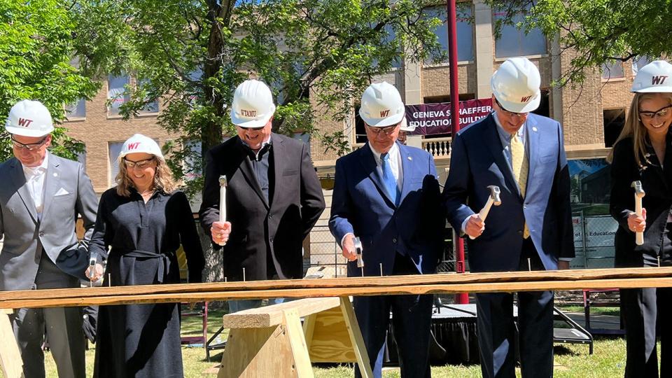 Construction officially began Monday, May 13 on the Geneva Schaeffer Education Building at West Texas A&M University. Pictured ceremonially driving hammers to signal the start of construction are, from left, Dr. Neil Terry, WT provost and executive vice president of academic affairs; Emily Winters of architect DLR Group; Gary Hall of The Texas A&M University System's Facilities Planning & Construction; TAMUS Chancellor John Sharp; WT President Walter V. Wendler; and WT Student Body President Kyal Browne.