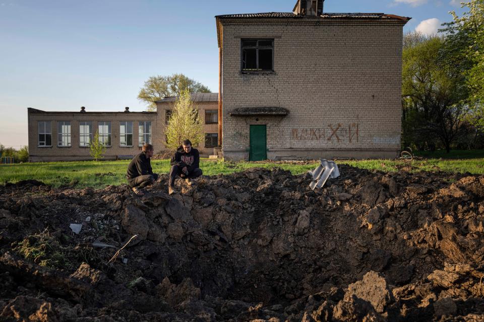 A crater created by a Russian rocket attack in Dobropillya, in the Donetsk region (AP)